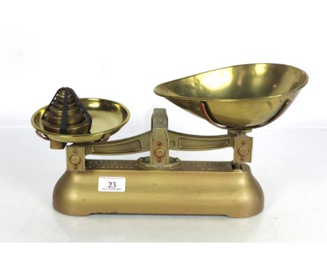 A set of W & T Avery Ltd kitchen scales with brass pans and set of brass weights 