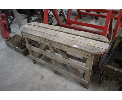 A wooden slatted oval bench