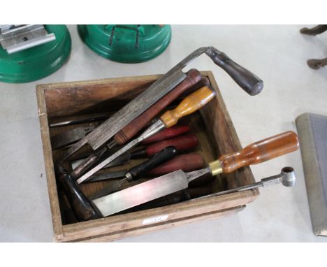 A box of wood workers tools including spoke shave, chisels etc.