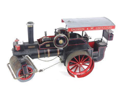 A spirit fired model of a traction steam roller, approx. 19&frac12;" long x 10&frac12;" high
