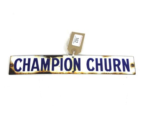 A small enamel sign for "Champion Churn", approx. 12" x 2"