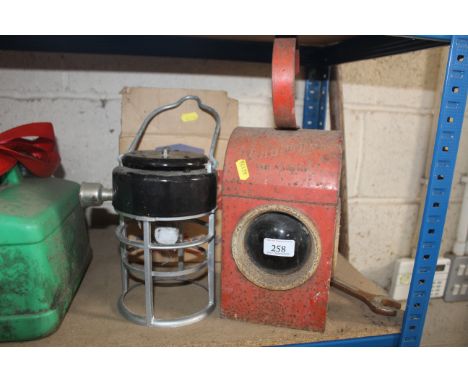 A vintage red Chalwyn road lamp and a Handy Light AF