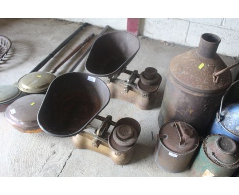 Two sets of shop scales with some weights