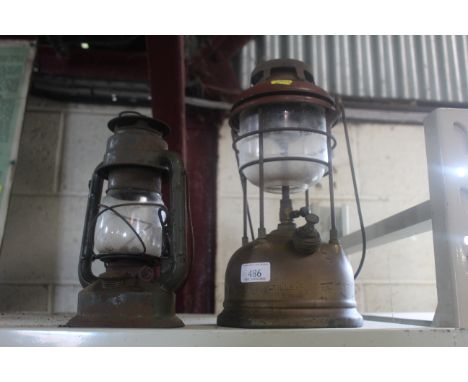 A Tilley lamp and a Hurricane lamp