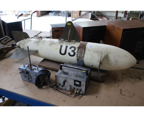 A hand made radio controlled submarine - vendor reports made from a shell casing  - sold as a collector's item