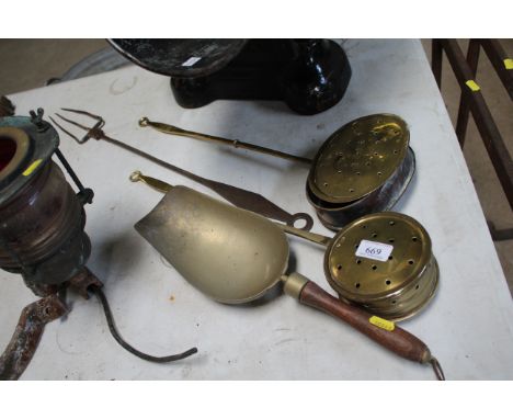 Two brass chestnut roasters, a brass scoop and a brass toasting fork