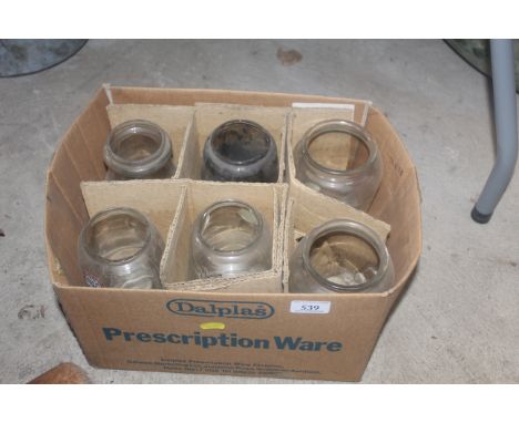 A box containing six oil lamp chimneys