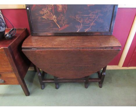 A circa 1680 pegged oak gate-leg table the rising legs and oval top over a single cutlery end drawer on turned legs and carve