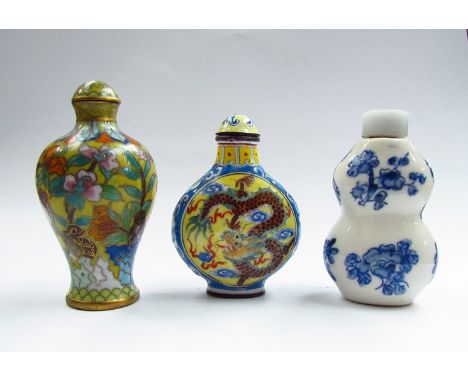 Three Chinese snuff bottles, character marks to base of one, enamel floral and bird design example 