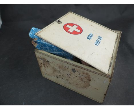 A vintage first aid tin with contents  
