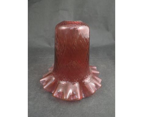 A cranberry glass lamp shade  