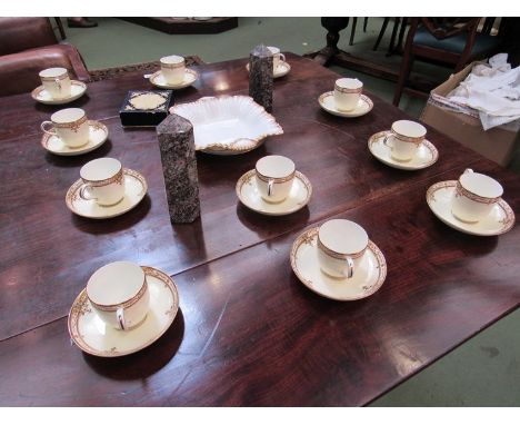 Eleven cups and saucers, two demitasse stone obelisks and a Crown Derby pin dish 