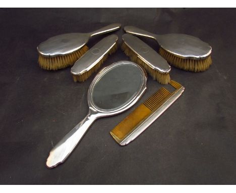 A silver backed six piece dressing table set, comb a/f