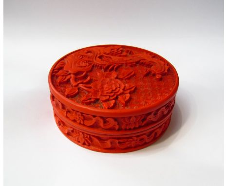 An Oriental cinnabar lidded trinket pot, 10cm diameter 