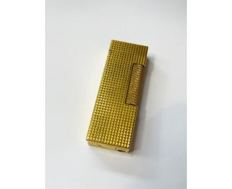 A Dunhill lighter, patented USRE 24163