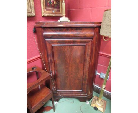 A Victorian flame mahogany corner cupboard with cushion drawer over door, to shaped bracket feet