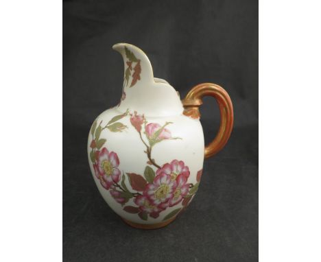 A Royal Worcester ewer cream ground with painted blossom design, gilt handle and base