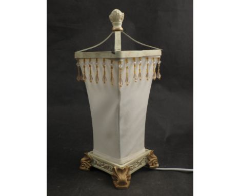 A cream table lamp with beaded detail