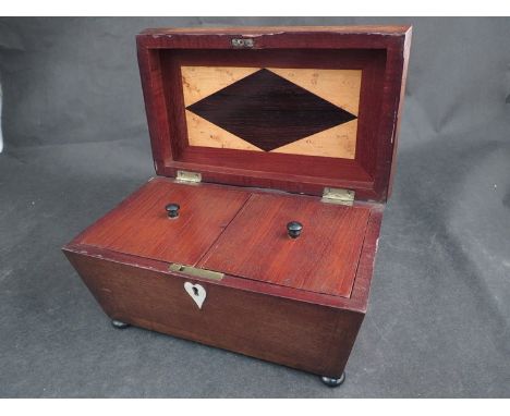 A 19th Century rosewood and ebonised twin compartment tea caddy