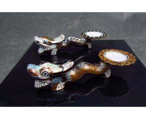 A near pair of cloisonné chopstick rests of dragon form 