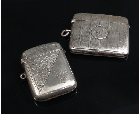 Two silver Vesta cases, one with scroll detail the other engine turned, both monogrammed, 59g