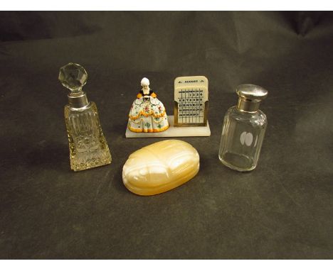 Two glass perfume bottles one with silver collar marked London, the other has a silver lid marked London, an alabaster paperw