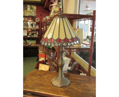 A Tiffany style table lamp with red and cream glass shade 