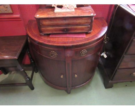 A 19th Century inlaid mahogany tambour/bow-front side cabinet with three drawers