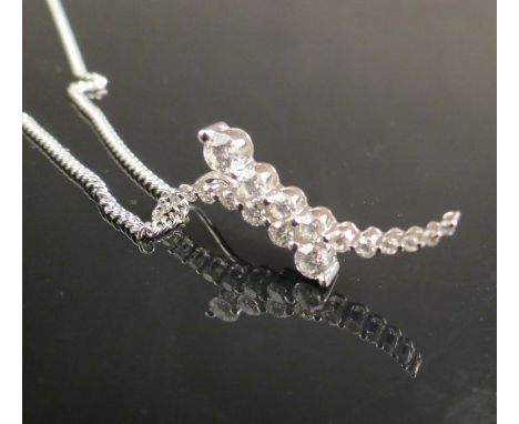 An 18ct gold diamond pendant 0.75cts with 9ct gold chain 