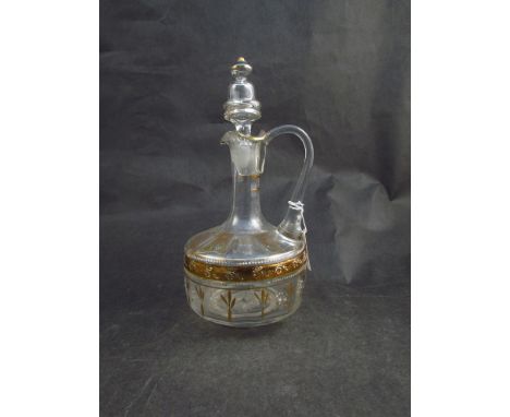 A Georgian claret jug with hand painted enamel and gilt detail 