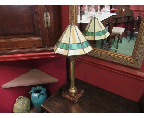 A tall table lamp with onyx base, fluted Roman column stem and a cream and green Tiffany style shade 