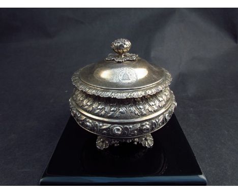 A Rebecca Emes and Edward Barnard I silver circular tea caddy, embossed borders, floral knop, bearing beehive crest, raised o