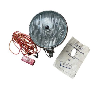 New old stock Lucas auxiliary driving lamp, model SFT700S / SLR700S in original box.