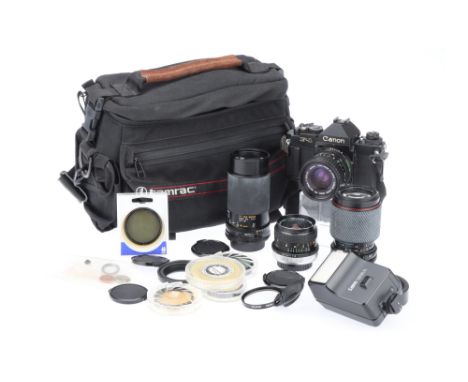 A Good Canon F-1 35mm SLR Camera Outfit, black, body G, shutter working, meter responds to light, viewfinder optics VG-E, tog