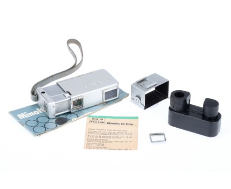 A Minolta 16 Subminiature Camera Outfit, chrome, body G, shutter working, together with a tripod clamp, spare film cartridge 