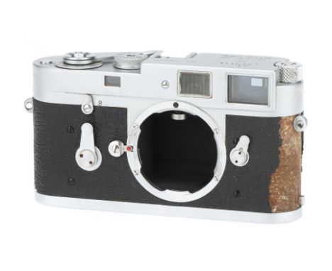 A Leitz Leica M2 35mm Rangefinder Camera, chrome, c.1962, serial no.1060894, body G, shutter working, signs of wear & tear, r