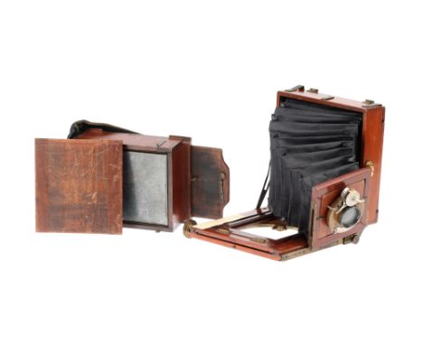 An Unmarked Quarter Plate Mahogany &amp; Brass Field Camera, damage to front standard, ground glass intact, with a plate chan
