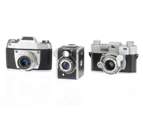 A Selection of Three Analogue Film Cameras, to include an Exa IIB 35mm SLR camera, chrome, body &amp; lens A/F, also with a K