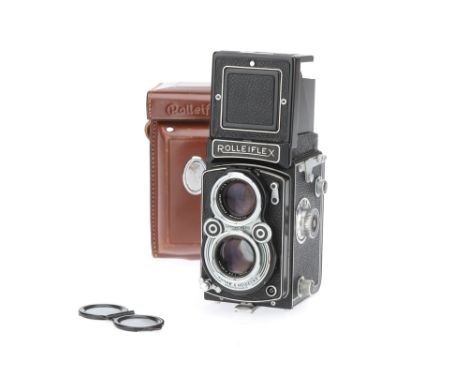 A Rolleiflex 2.8 A Medium Format TLR Camera, black, body G-VG, shutter working, with Zeiss-Opton f/2.8 80mm taking lens, opti