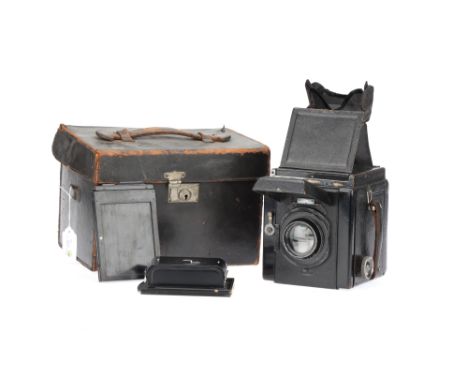 A Houghton Ensign De Luxe Reflex SLR Camera, black, body G, shutter requires attention, with Dallmeyer Press 6" f/3.5 lens, i