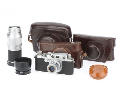 A Selection of Leitz Leica Items, to include a Leica IIIf 35mm rangefinder camera, chrome, shutter working, RF patch very dim