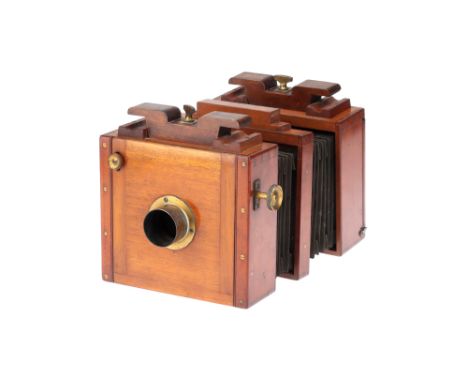 An Early Watson &amp; Sons Mahogany &amp; Brass Half Plate Studio Rail Camera, mahogany &amp; brass, missing lens, ground gla