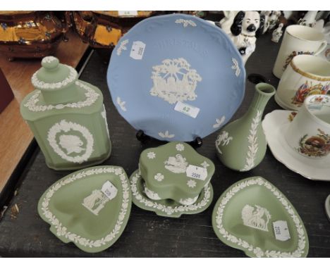 A selection of Jasper ware by Wedgwood including lidded caddy and two flat back dogs