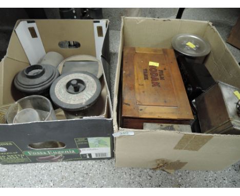 Two boxes of darkroom equipment, includes development tanks, measures enlarger lens etc