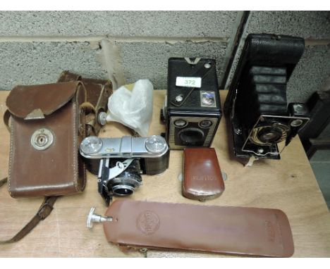 A selection of camera equipment. A Voigtlander Vito folding camera with Prontor II, a Kodak Brownie Six-20  model C, a Super 