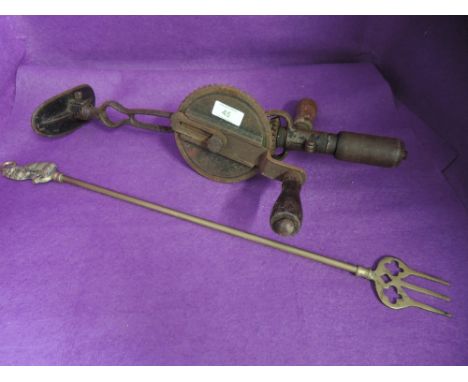 A drill brace by Stanley no. 733 and brass cast toasting fork