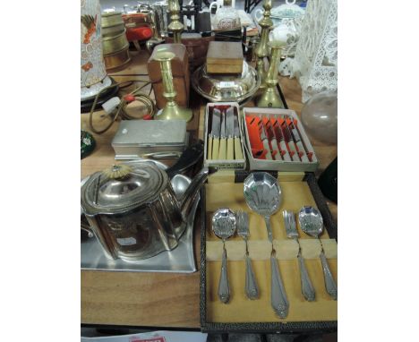 A selection of boxed cutlery and flatware also brass candle stick selection