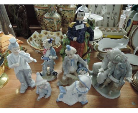 A selection of ceramic figures and figurines including Napoleon flatback