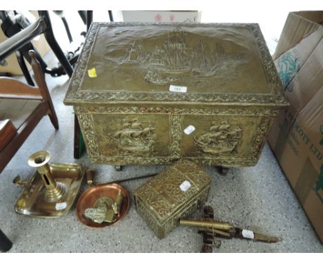 A selection of brass wares including slipper box and chamber stick