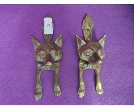 A pair of brass cast door knocker in the form of a fox possibly hunt related